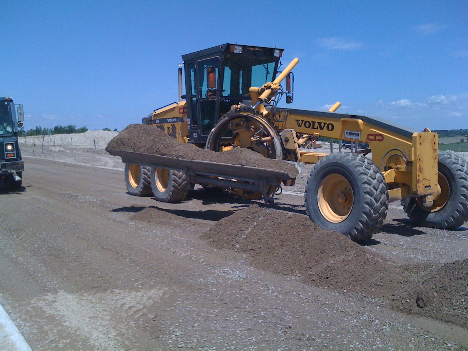 Heavy equipment grading a roadbed